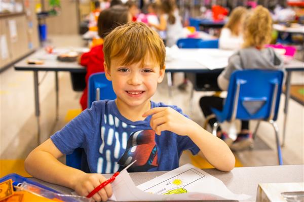 Students inside their classrooms learning. 